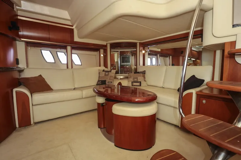 Slide: The Image of Luxurious interior of 2006 Sea Ray 52 Sundancer yacht with elegant seating and wooden accents. - 14