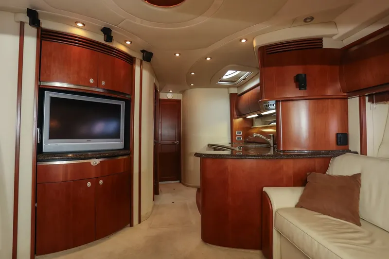 Slide: The Image of Luxurious interior of 2006 Sea Ray 52 Sundancer yacht with wood finishes and modern amenities. - 13