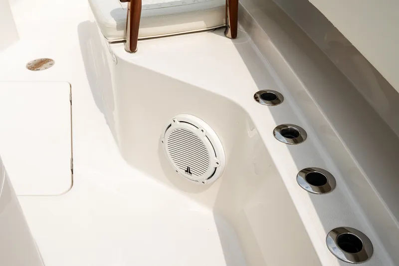 Slide: The Image of Interior of 2021 Jupiter 43 boat featuring seating and built-in speaker. - 57