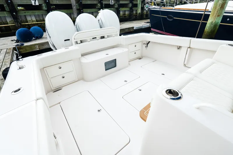 Slide: The Image of Spacious deck of 2021 Jupiter 43 boat with storage compartments and seating. - 13