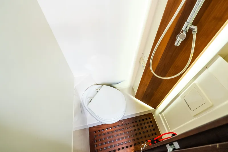 Slide: The Image of Compact bathroom with toilet and shower in 2021 Jupiter 43 model boat. - 68