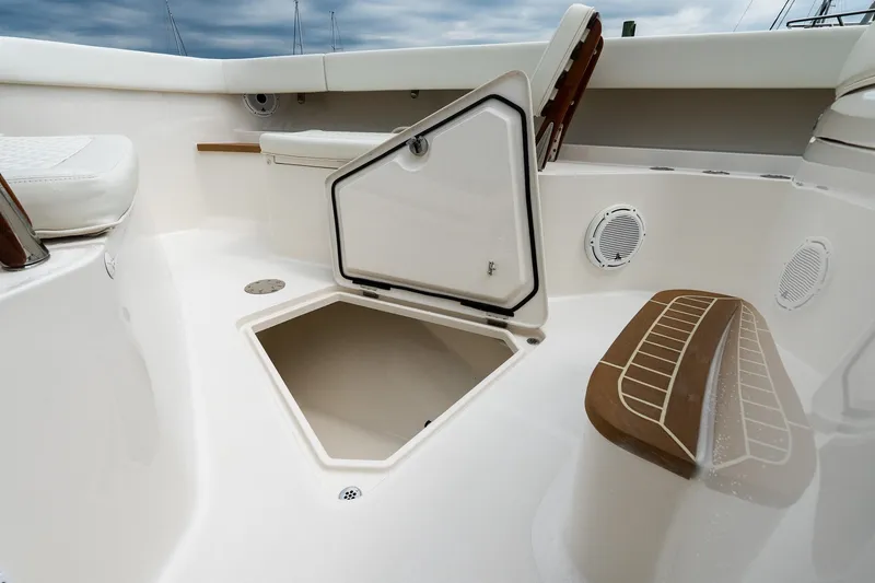 Slide: The Image of 2021 Jupiter 43 boat interior with open storage compartment and seating. - 59