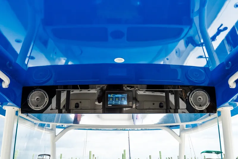 Slide: The Image of Blue interior of 2021 Jupiter 43 boat with speakers and control panel. - 41