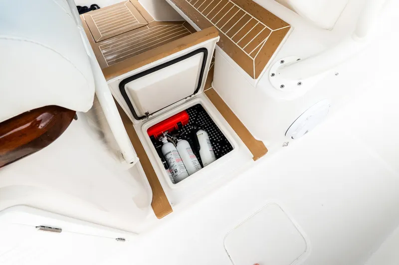 Slide: The Image of Storage compartment on 2021 Jupiter 43 boat with fire extinguishers inside. - 39