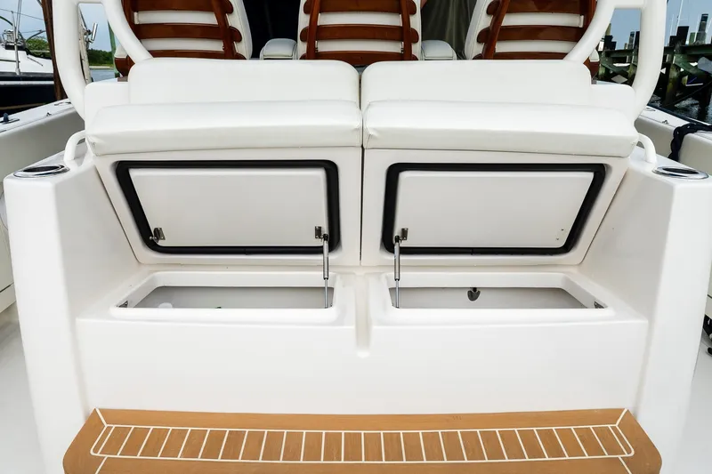 Slide: The Image of Jupiter 43 boat, 2021 model, featuring open storage compartments and cushioned seating. - 30