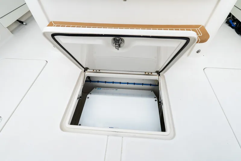 Slide: The Image of Open storage compartment on 2021 Jupiter 43 boat deck. - 25