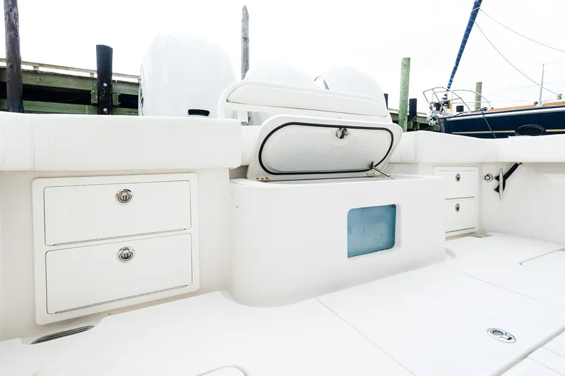 Slide: The Image of 2021 Jupiter 43 boat interior with storage compartments and open hatch. - 17
