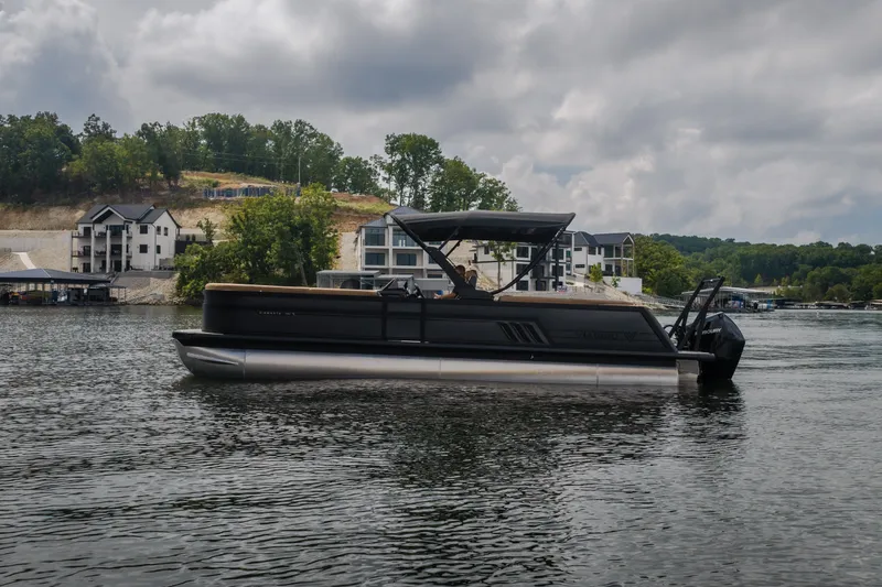 Slide: The Image of 2026 Viaggio Diamante U 26 pontoon boat on a scenic lake with modern homes. - 50