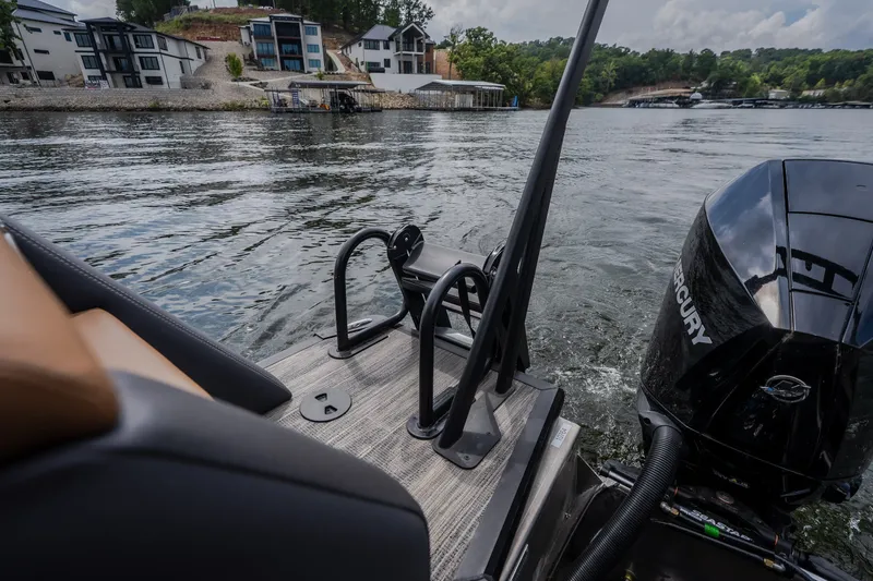 Slide: The Image of Viaggio Diamante U 26 boat on water, featuring Mercury engine, lakeside homes in background. - 43