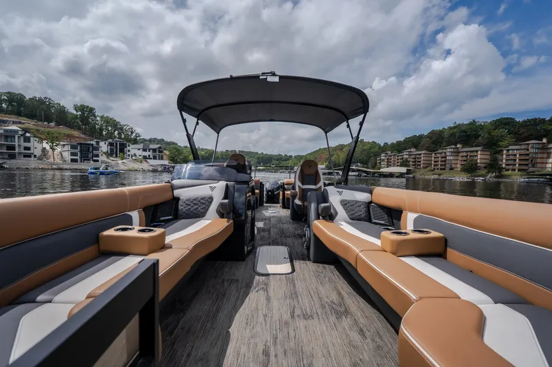 Slide: The Image of Luxurious 2026 Viaggio Diamante U 26 pontoon boat interior with plush seating on a scenic lake. - 30