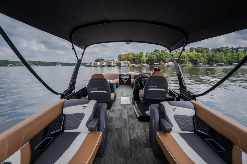 Slide: The Image of 2026 Viaggio Diamante U 26 boat interior with luxurious seating on a serene lake. - 44