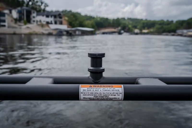 Slide: The Image of Ski bar on Viaggio Diamante U 26 boat, warning label visible, lake background. - 45