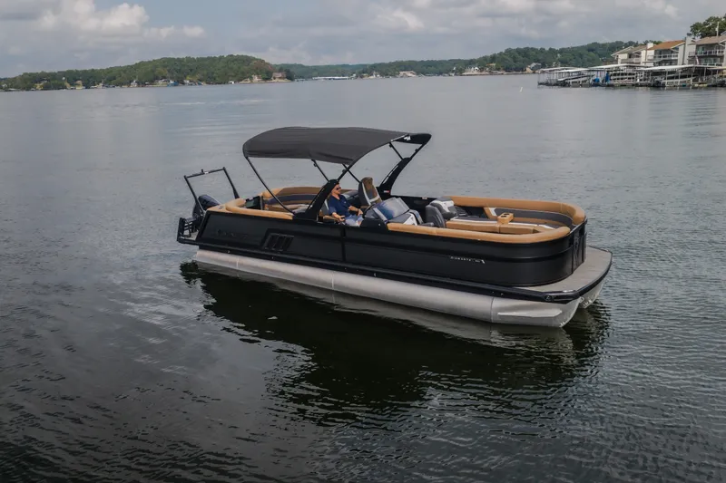 Slide: The Image of 2026 Viaggio Diamante U 26 pontoon boat on a serene lake with scenic background. - 53