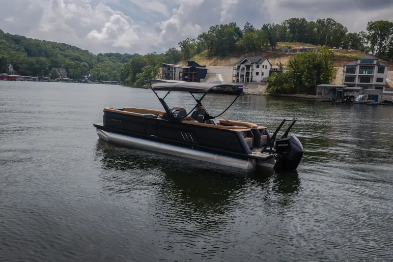 Slide: The Image of 2026 Viaggio Diamante U 26 pontoon boat on a scenic lake with modern homes in the background. - 51