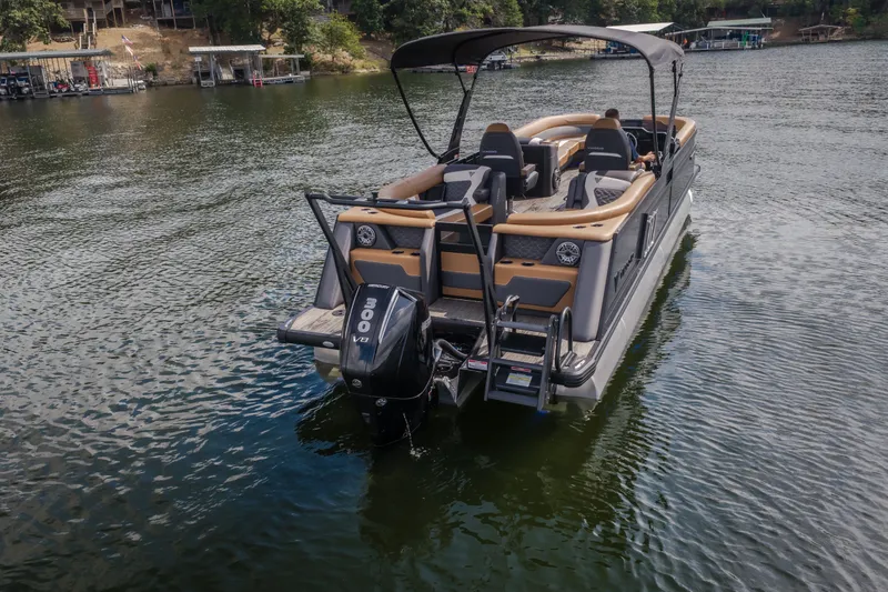 Slide: The Image of 2026 Viaggio Diamante U 26 pontoon boat on a serene lake with powerful outboard motor. - 58