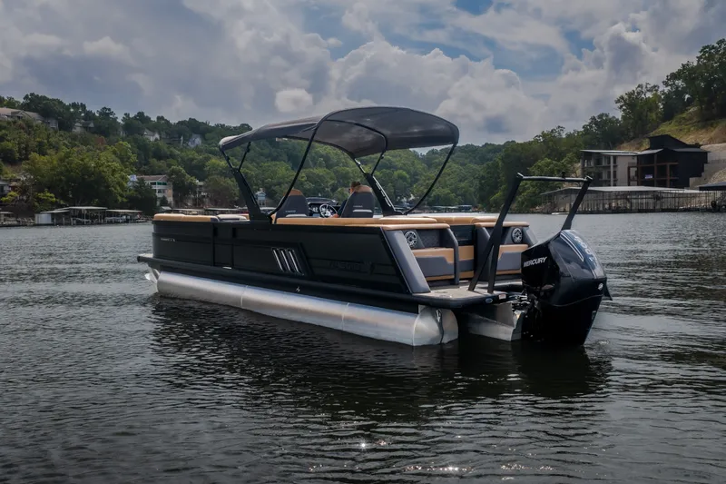 Slide: The Image of 2026 Viaggio Diamante U 26 pontoon boat on a scenic lake with lush greenery. - 56