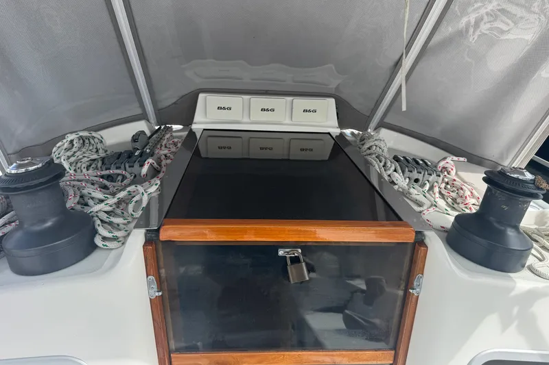 Slide: The Image of Cockpit of 1998 J Boats J/160 with winches and ropes under a canopy. - 23