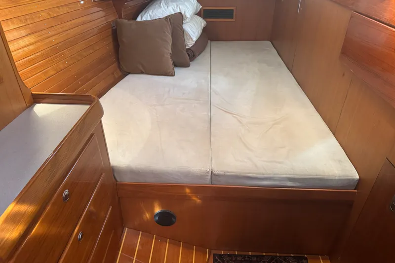 Slide: The Image of Cozy cabin interior of 1998 J Boats J/160 with wooden finish and comfortable bedding. - 16