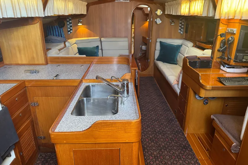 Slide: The Image of Luxurious interior of 2020 J Boats J/160 yacht with wood finish and modern amenities. - 1