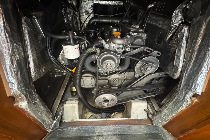 Slide: The Image of Engine compartment of a 2020 J Boats J/160 sailboat, featuring a Yanmar engine. - 13