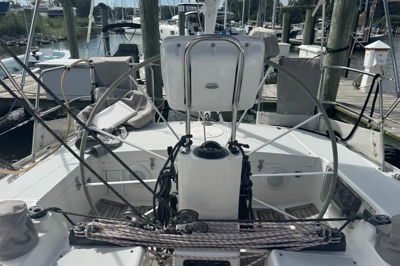 Slide: The Image of Cockpit of a 1998 J Boats J/160 sailboat docked at a marina. - 22