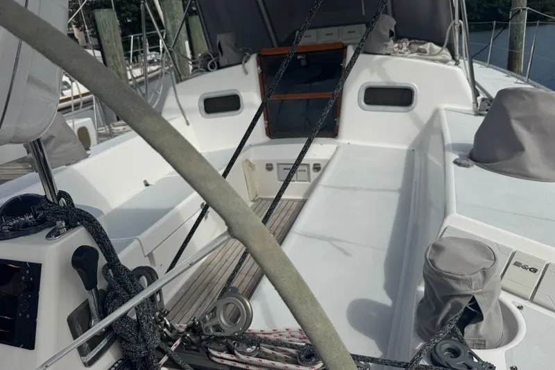 Slide: The Image of Cockpit of 1998 J Boats J/160 sailboat with steering wheel and rigging details. - 24
