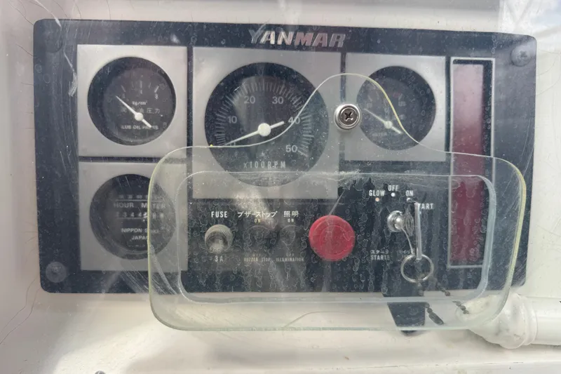 Slide: The Image of Control panel of a 1998 J Boats J/160 with Yanmar engine gauges and switches. - 26