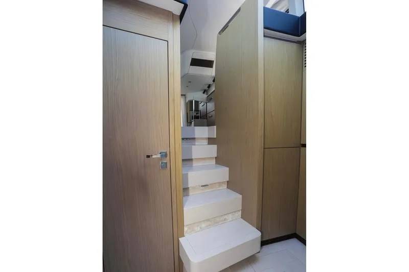 Slide: The Image of Interior staircase of 2023 Azimut Fly 50 yacht, featuring modern wooden design. - 22