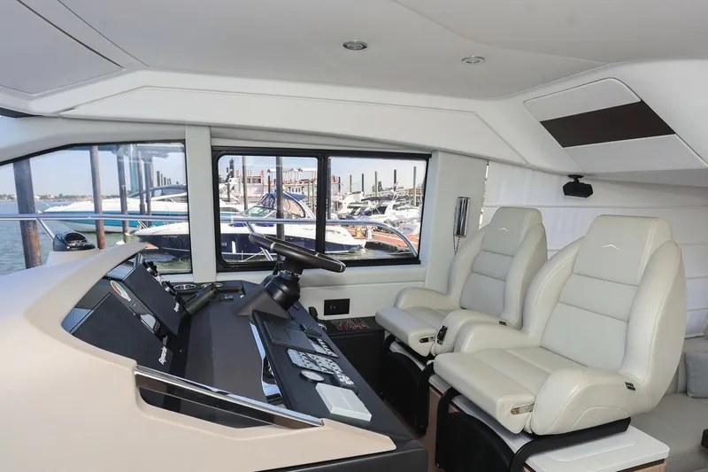 Slide: The Image of Interior of 2023 Azimut Fly 50 yacht with modern helm and luxurious seating. - 52
