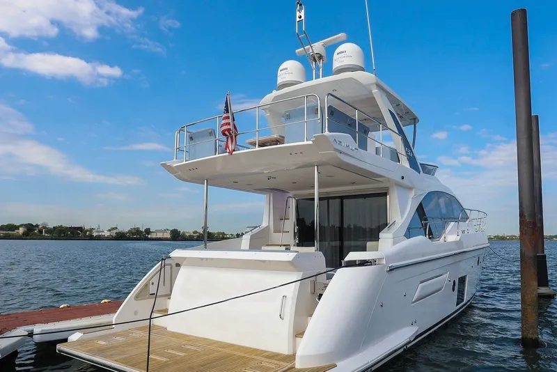 Slide: The Image of 2023 Azimut Fly 50 yacht docked, showcasing sleek design and luxury features. - 10