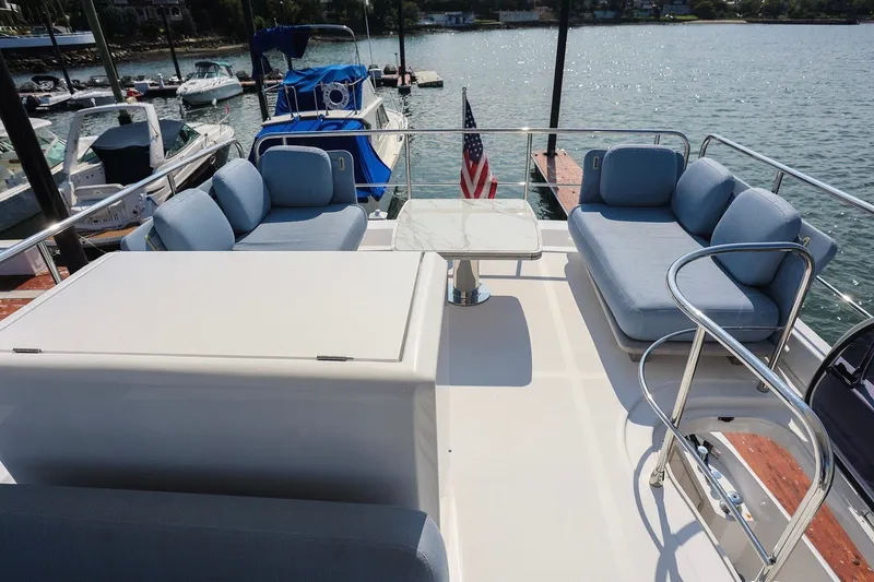 Slide: The Image of Luxurious 2023 Azimut Fly 50 yacht deck with comfortable seating and scenic waterfront view. - 11