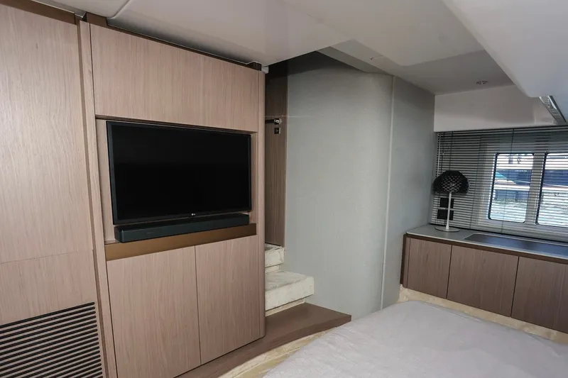 Slide: The Image of Luxurious interior of 2023 Azimut Fly 50 yacht with modern TV and elegant furnishings. - 54