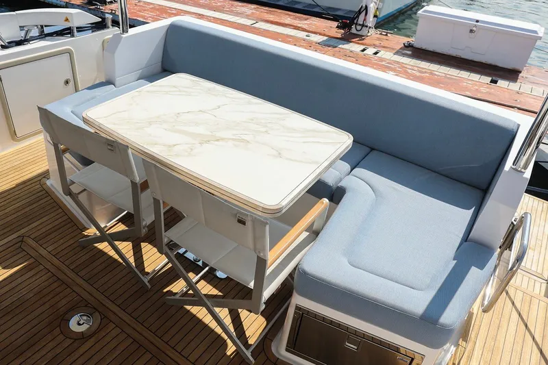 Slide: The Image of Luxurious seating area on 2023 Azimut Fly 50 yacht with elegant table and cushions. - 31