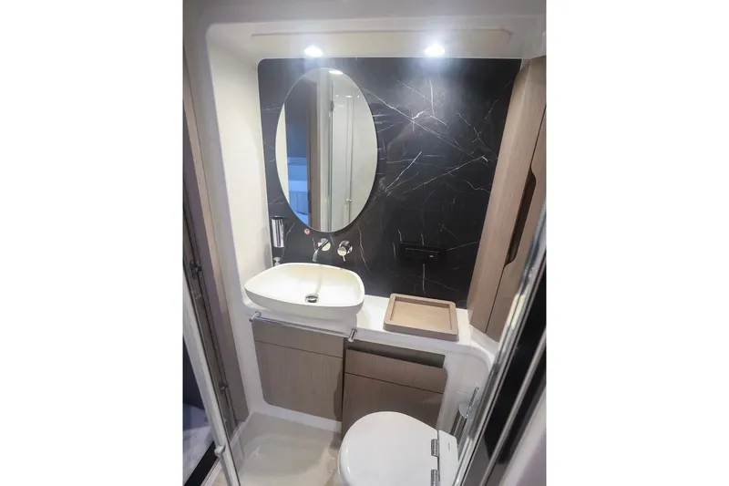 Slide: The Image of Luxurious bathroom in 2023 Azimut Fly 50 yacht with modern fixtures and elegant design. - 8