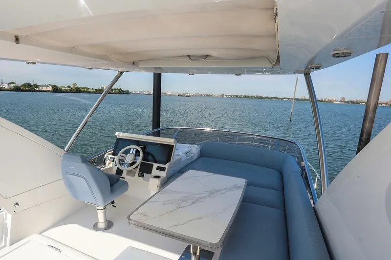 Slide: The Image of Luxurious 2023 Azimut Fly 50 yacht interior with elegant seating and scenic water view. - 49