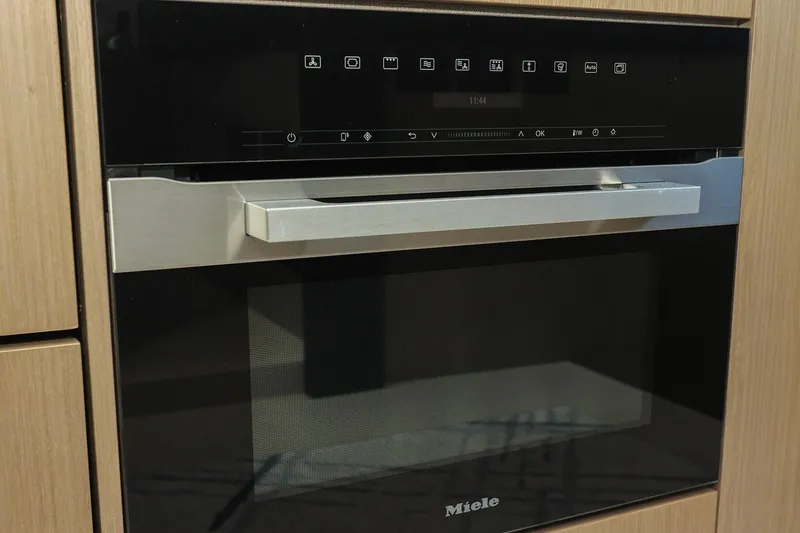 Slide: The Image of Modern Miele oven with sleek design, integrated in Azimut Fly 50 yacht kitchen, 2023 model. - 46