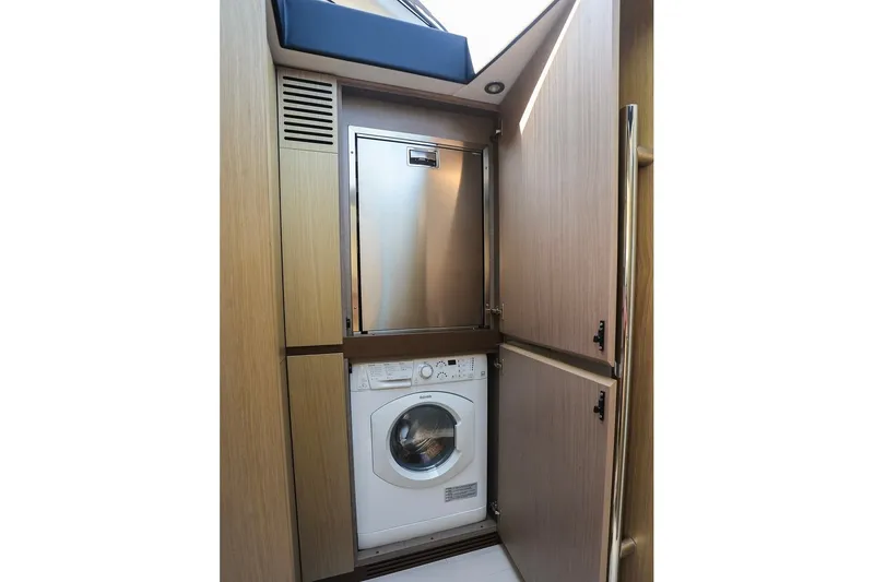 Slide: The Image of Laundry area in 2023 Azimut Fly 50 yacht with washing machine and storage. - 15