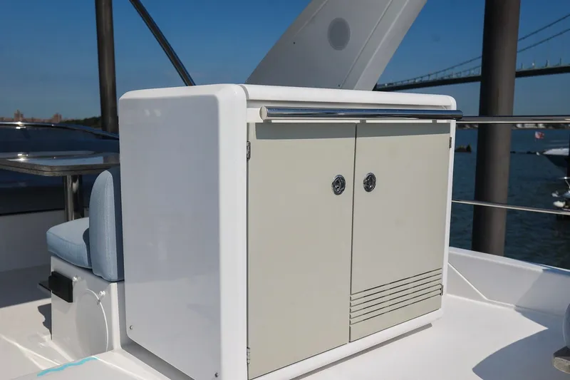 Slide: The Image of 2023 Azimut Fly 50 yacht deck with storage cabinet and seating. - 29