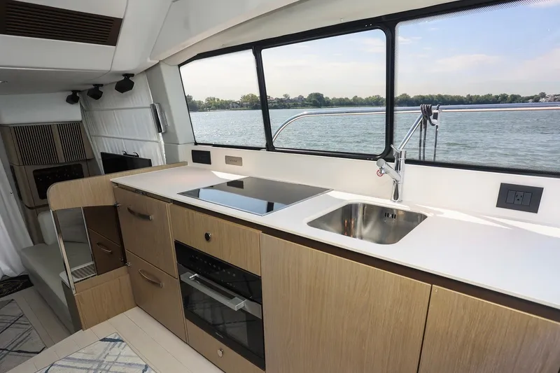 Slide: The Image of Modern kitchen interior of 2023 Azimut Fly 50 yacht with sleek design and water view. - 19
