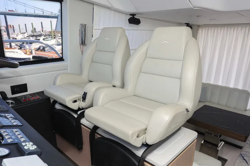 Slide: The Image of Luxurious interior of 2023 Azimut Fly 50 yacht with plush captain's chairs. - 35