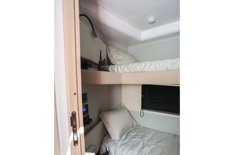 Slide: The Image of Interior of 2023 Azimut Fly 50 yacht featuring cozy bunk beds. - 26