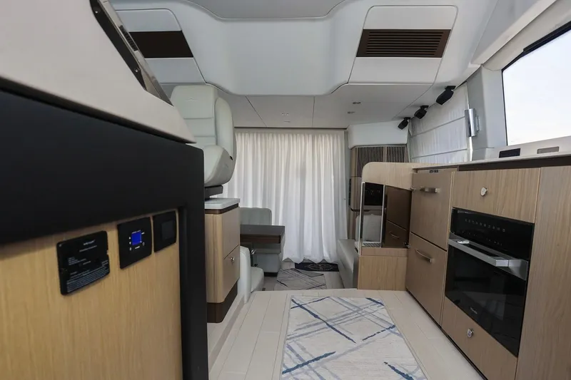 Slide: The Image of Luxurious interior of 2023 Azimut Fly 50 yacht with modern kitchen and seating area. - 37