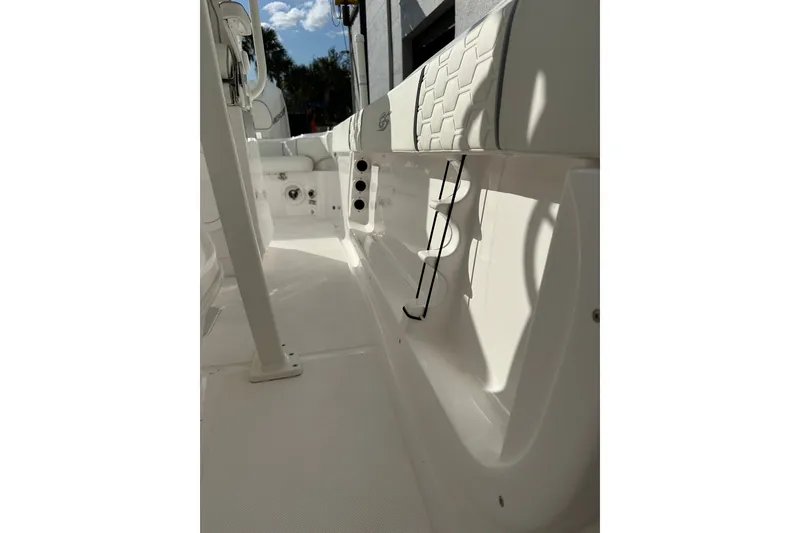 Slide: The Image of 2025 Glasstream 280 Pro-XS boat interior with white seating and sleek design. - 23