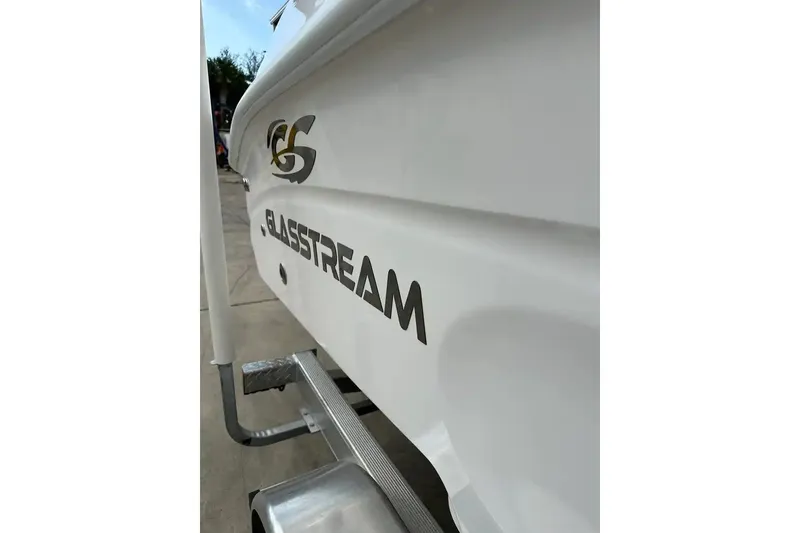 Slide: The Image of 2025 Glasstream 280 Pro-XS boat side view with logo and trailer. - 13
