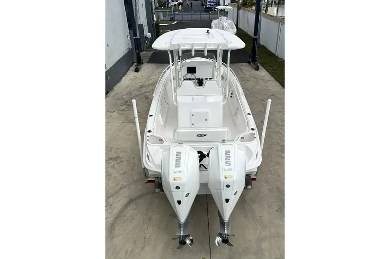 Slide: The Image of 2025 Glasstream 280 Pro-XS boat with dual outboard engines, viewed from the rear. - 11