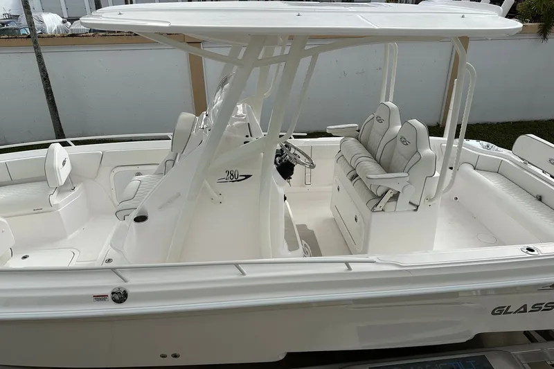Slide: The Image of 2025 Glasstream 280 Pro-XS boat interior with seating and helm station. - 9