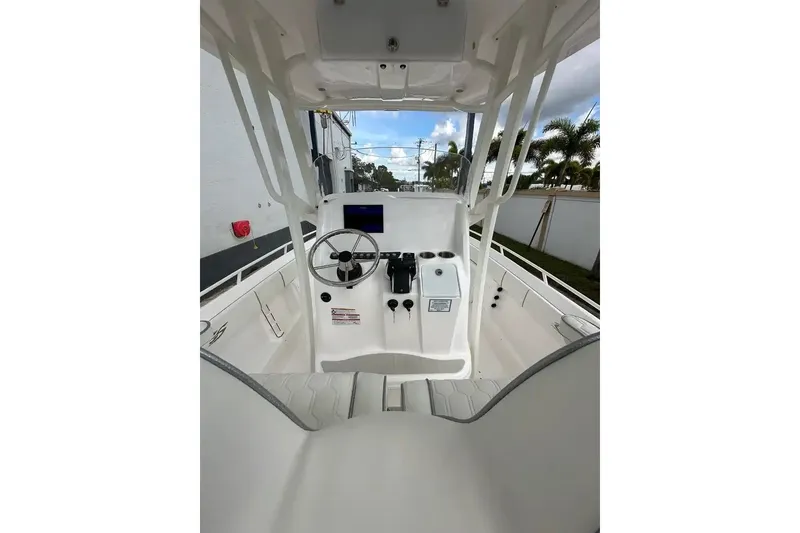 Slide: The Image of 2025 Glasstream 280 Pro-XS boat interior with steering wheel and control panel. - 16