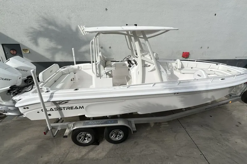 Slide: The Image of 2025 Glasstream 280 Pro-XS boat on trailer, side view, white exterior. - 4