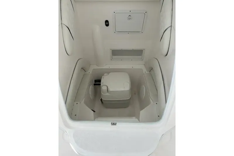 Slide: The Image of Interior of 2025 Glasstream 280 Pro-XS boat, featuring compact storage area. - 21