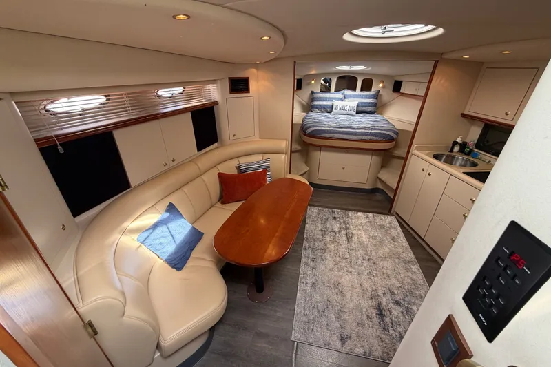 Slide: The Image of Luxurious interior of 2000 Cruisers Yachts 3870 Express with cozy seating and elegant design. - 11